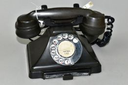 A BROWN BAKELITE TELEPHONE WITH DRAWER, recessed marks to the handset - 164 56, stencil marks to the
