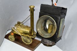 A CANDLE POWERED RAILWAY? LAMP TOGETHER WITH A BRASS MODEL OF STEPHENSON'S ROCKET