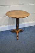 A VICTORIAN WALNUT TRIPOD TABLE, the top with a wavy edge, on a reeded support, diameter 43cm x