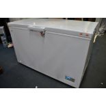 A LOGIK L400CFW16 CHEST FREEZER measuring width 130cm x depth 72cm x height 85cm with a lock and two