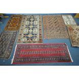 AN ASSORTMENT OF SIX RUGS, of various ages, styles, origin's and colours, largest rug 180cm x 106cm,