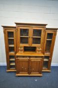 A PINE DRESSER, the central section top with two glazed windows, enclosing a single shelf, four