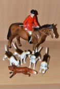 A BESWICK GROUP OF A MOUNTED HUNTSMAN, HOUNDS AND A FOX, comprising Huntsman model no 1501 height