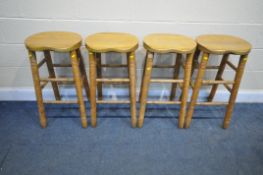A SET OF FOUR OAK HIGH STOOLS (condition - wear and tear, chip to back of one seat, one foot rest