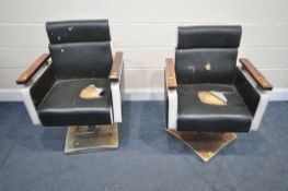 A PAIR OF MID CENTURY BLACK LETHERETTE UPHOLSTERED SWIVEL BARBERS CHAIRS, on a square chrome base,