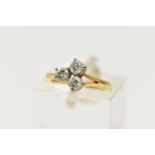 AN 18CT YELLOW GOLD, THREE STONE DIAMOND RING, three claw set, round brilliant cut diamonds,