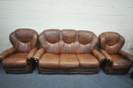 A BROWN LEATHERETTE THREE PIECE SUITE, comprising a three seater sofa, and two armchairs (