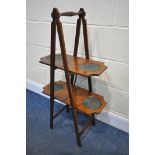 A EDWARDIAN MAHOGANY AND INLAID TWO TIER FOLDING CAKE STAND, stamped verso, Schafers folding cake