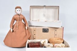 AN UNMARKED FRENCH FASHION DOLL, c.1870, Bisque shoulder head, Bru type face with some damage, fixed