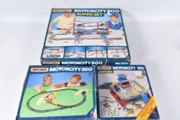 THREE BOXED MATCHBOX MOTORCITY PLAYSETS, Airport, No.MC150, Railway, No.MC250 and Garage Super