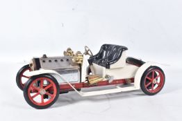 AN UNBOXED MAMOD LIVE STEAM ROADSTER, No.SA1, cream in colour with red trim and gold plated