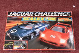 A BOXED SCALEXTRIC JAGUAR CHALLENGE SET, No.C707, appears largely complete with both cars,