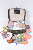 A SMALL SUITCASE OF DOLLS CLOTHING, dates from the 1950's - 1970's, majority appears to be for dolls
