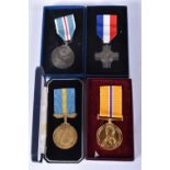 A GROUP OF FOUR POST WWII MEDALS, to include a Berlin Aircraft medal, a general service cross, an