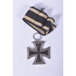 A WWI GERMAN IRON CROSS 2ND CLASS, it has a magnetic core and was awarded for the persons who were