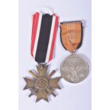 A GERMAN 1939 WAR MERIT CROSS AND A 1936 THIRD REICH BERLIN OLYMPICS MEDAL, the war Merit Cross