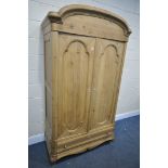 A 19TH CENTURY FRENCH PINE PANELLED TWO DOOR WARDROBE, above a single long drawer, width 117cm x