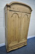 A 19TH CENTURY FRENCH PINE PANELLED TWO DOOR WARDROBE, above a single long drawer, width 117cm x