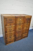A SET OF THREE EARLY TO MID 20TH CENTURY OAK FILING CABINETS, four drawers to each cabinet, a