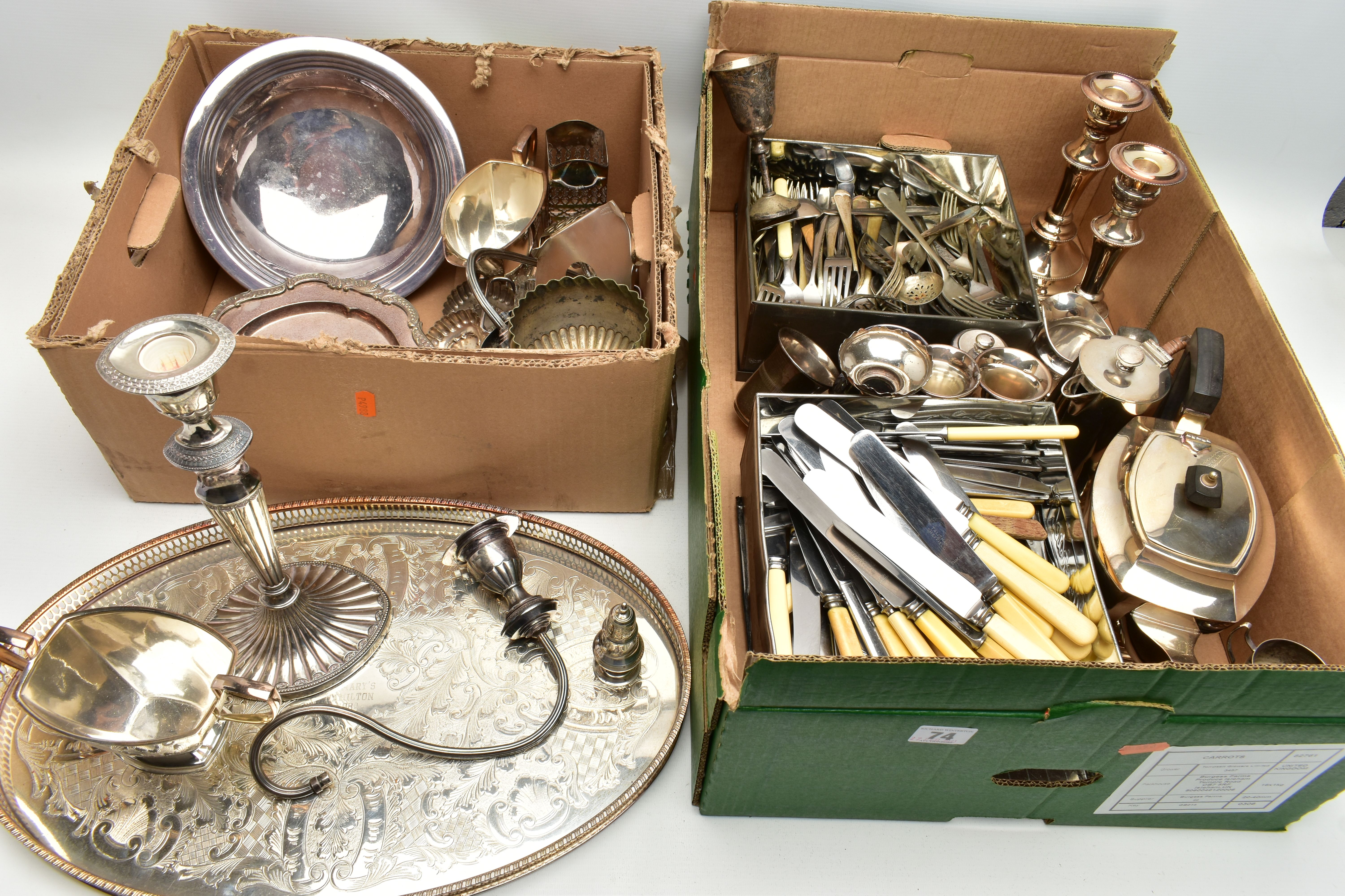 TWO BOXES OF ASSORTED WHITE METAL WARE, to include a silver-plated three branch candlestick with