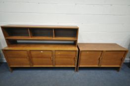 A MID CENTURY WALNUT SIDEBOARD, with a raised loose open section, above three cupboard doors,