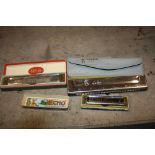 THREE HOHNER HARMONICAS comprising of a boxes Super Vamper, a boxed Echo and a boxed Sirena