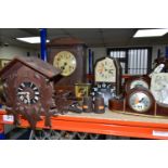 A GROUP OF CLOCKS AND BAROMETERS, to include a cuckoo clock with weights, two mantel clocks, a