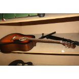 A FENDER FA 125/SB ACOUSTIC GUITAR and a music stand Condition some repaired damage to body and
