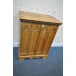 A PINE MEDIA CABINET, with gothic panelled bi-fold doors, width 75cm x depth 49cm x height 100cm (