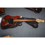 A 2005 SQUIER JAZZ BASS professionally de fretted with natural walnut coloured body, maple neck