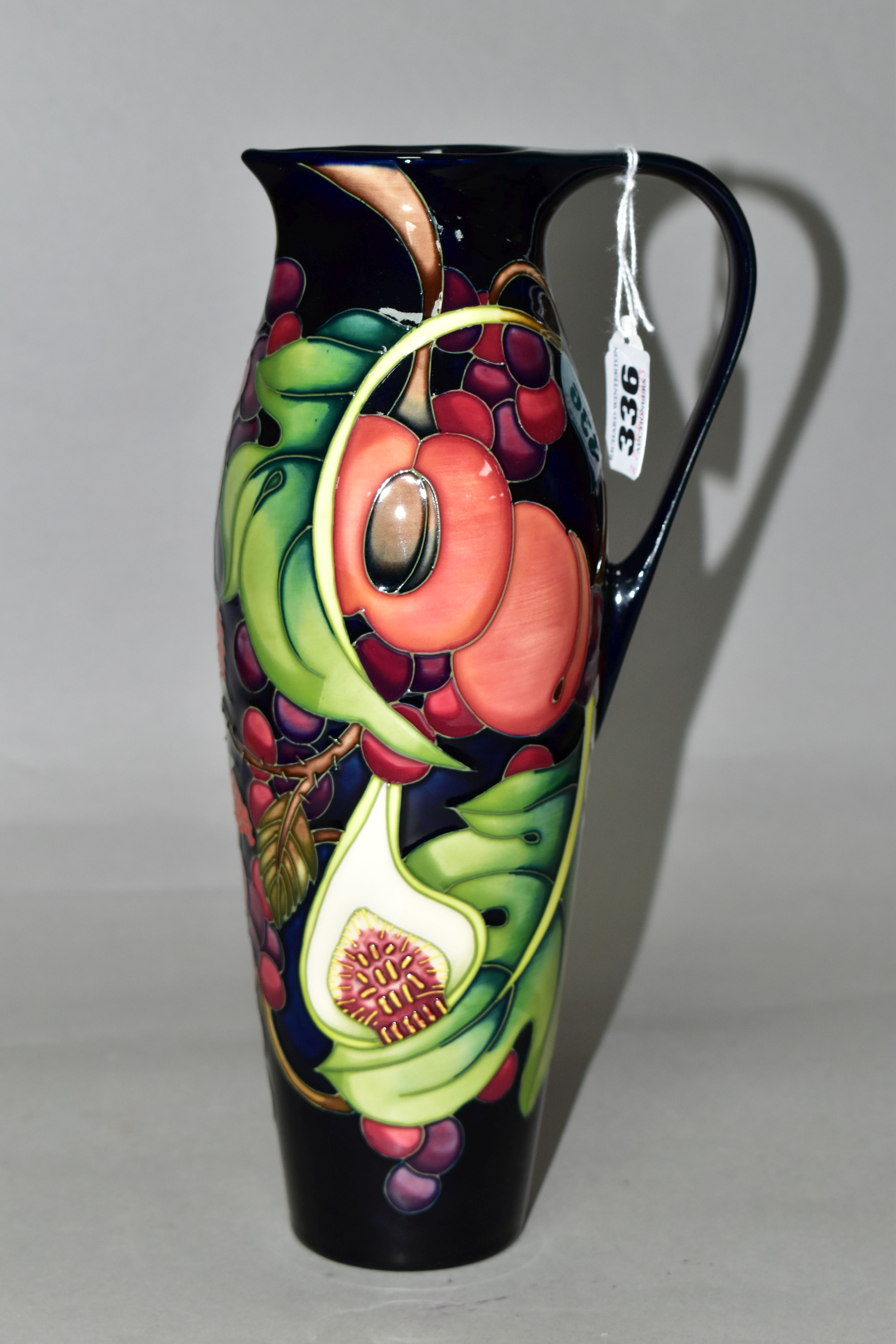 A MOORCROFT POTTERY JUG WITH BOX, in the 'Queens Choice' pattern designed by Emma Bossons, of