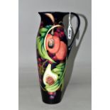 A MOORCROFT POTTERY JUG WITH BOX, in the 'Queens Choice' pattern designed by Emma Bossons, of