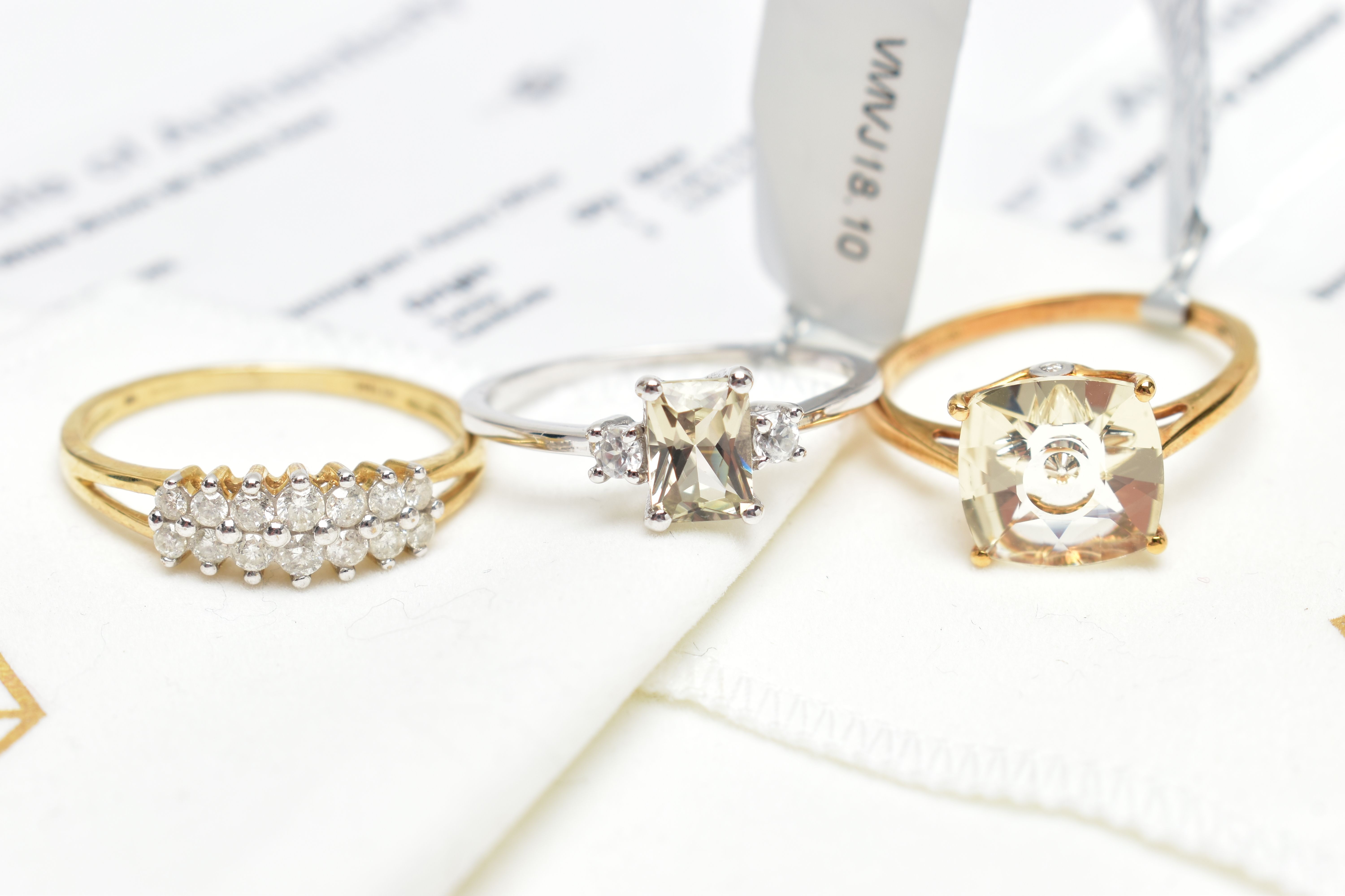 THREE GEM SET RINGS, to include a yellow metal diamond ring, set with two rows of brilliant cut - Image 2 of 5