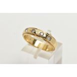 A 9CT GOLD DIAMOND BAND RING, a yellow gold band ring with step cut edges, approximate width 4.
