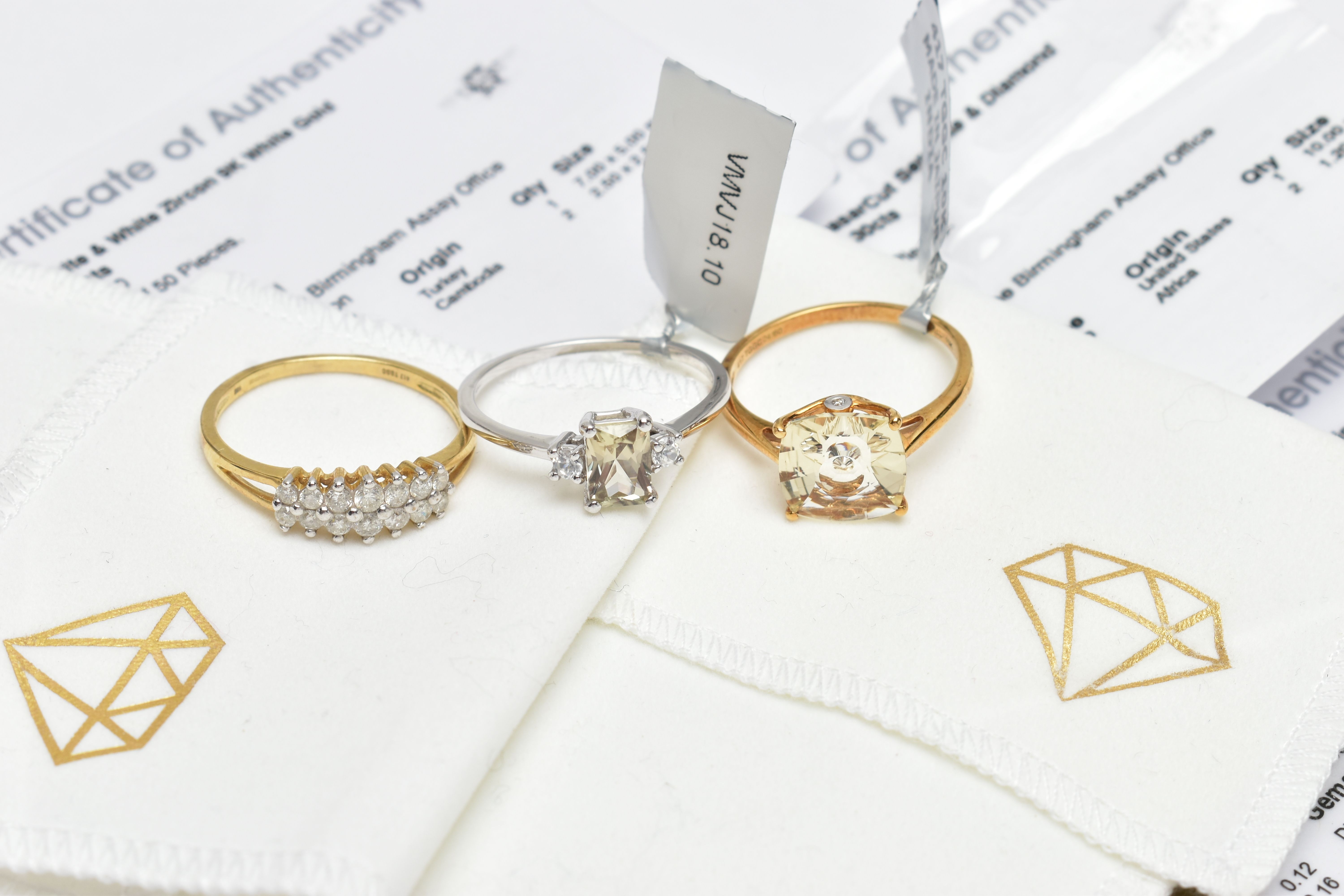 THREE GEM SET RINGS, to include a yellow metal diamond ring, set with two rows of brilliant cut