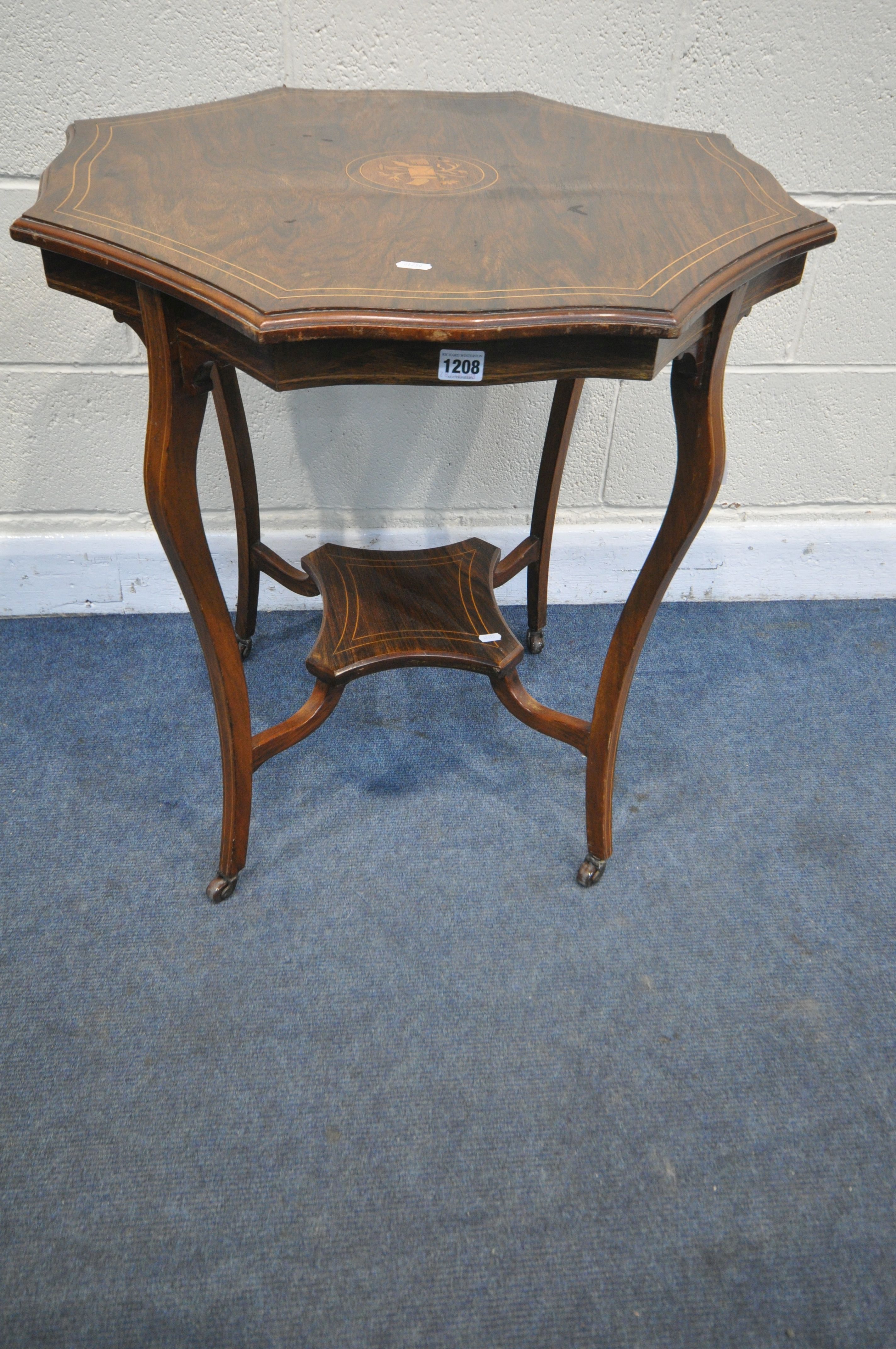 AN EDWARDIAN ROSEWOOD OCTAGONAL CENTRE TABLE, with a wavy edge top, shaped legs and stretchers,