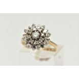 A YELLOW METAL DIAMOND CLUSTER RING, flower shape cluster, set with round brilliant cut and single