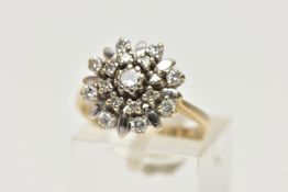 A YELLOW METAL DIAMOND CLUSTER RING, flower shape cluster, set with round brilliant cut and single