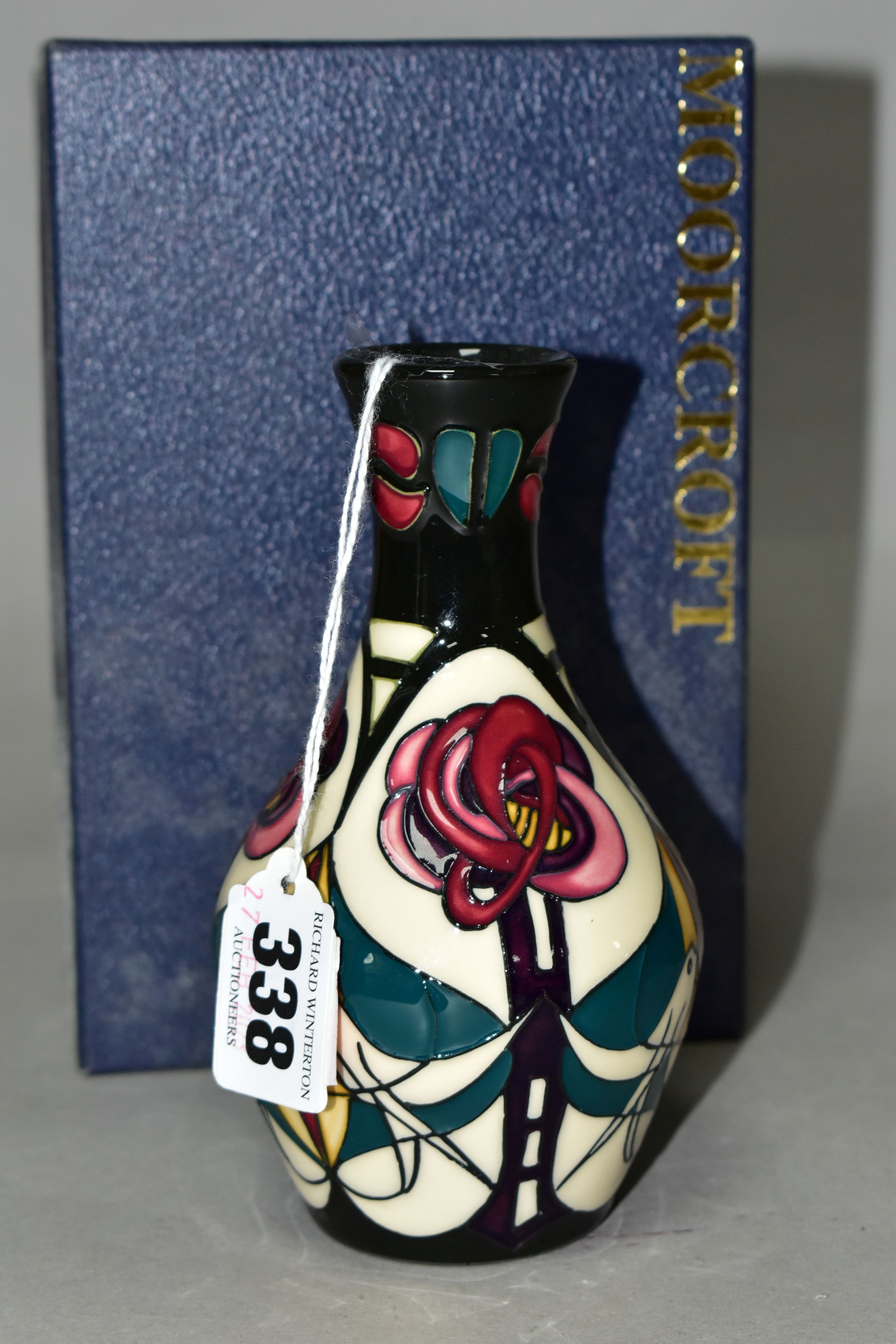 A MOORCROFT POTTERY 'MELODY' PATTERN, bud vase with original box, designed by Sian Leaper, decorated