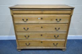 A 19TH CENTURY FRENCH PINE CHEST OF FIVE DRAWERS, with a single frieze drawer, swan neck handles, on