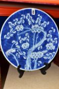 A LATE NINETEENTH CENTURY CHINESE PORCELAIN CHARGER, decorated in blue and white Prunus Blossom