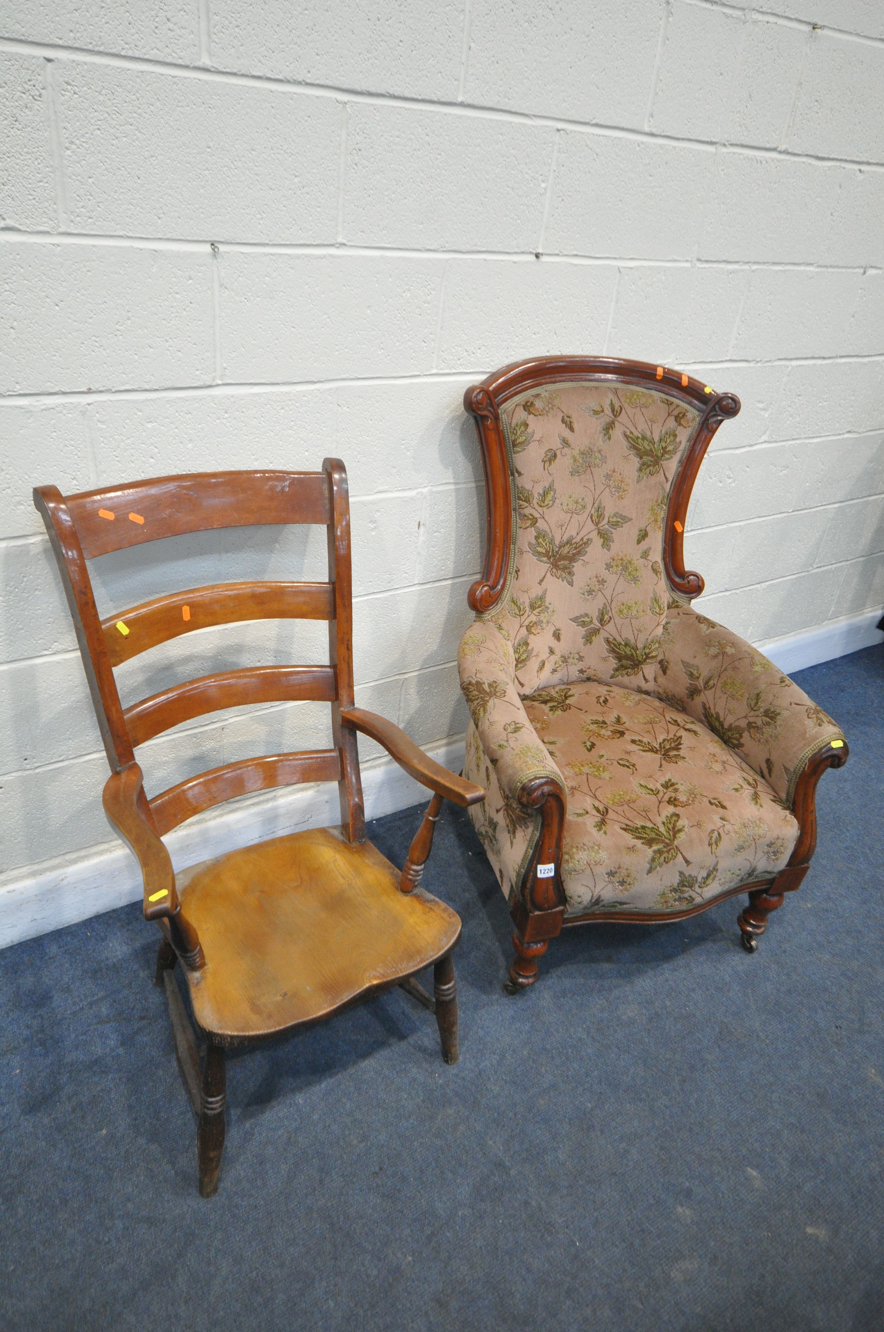 A LATE VICTORIAN WALNUT ARMCHAIR, with floral fabric, and a 19th century elm ladderback armchair (