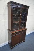 A MAHOGANY TWO DOOR BOOKCASE, with two drawers, width 95cm x depth 41cm x height 192cm