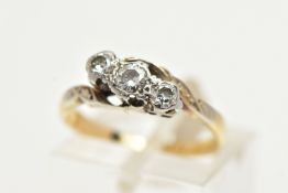 A THREE STONE DIAMOND RING, three round brilliant cut diamonds. set in a white metal twisted