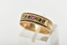 A 9CT YELLOW GOLD ACROSTIC RING, set with a row of circular cut gemstones spelling out the word '