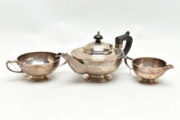 A GEORGE V SILVER THREE PIECE BACHELOR'S TEA SET OF CIRCULAR FORM, with shallow concentric