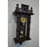 A LATE 19TH CENTURY WALNUT VIENNA WALL CLOCK, with a winding key and pendulum (condition:-missing