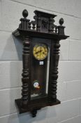 A LATE 19TH CENTURY WALNUT VIENNA WALL CLOCK, with a winding key and pendulum (condition:-missing