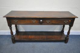 A REPRODUCTION OAK DRESSER BASE, with two drawers, on turned and block legs, united by an