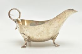 A GEORGE VI SILVER SAUCE BOAT, of plain form, on three cabriole legs, ring handle, makers James